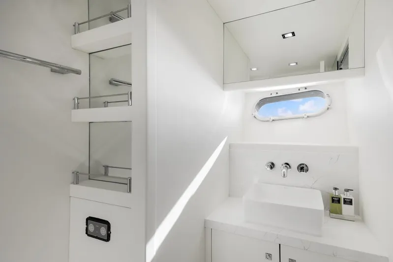 Skyfall Yacht Photos Pics Luxurious bathroom in 2008 Sunseeker Predator 108 yacht, featuring sleek white design and modern fixtures.