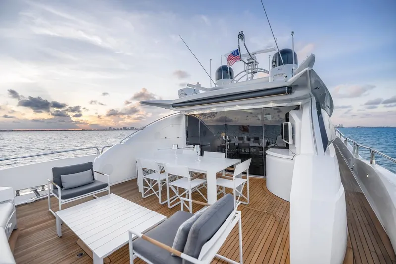 Skyfall Yacht Photos Pics Luxurious 2008 Sunseeker Predator 108 yacht deck with elegant seating and ocean view.