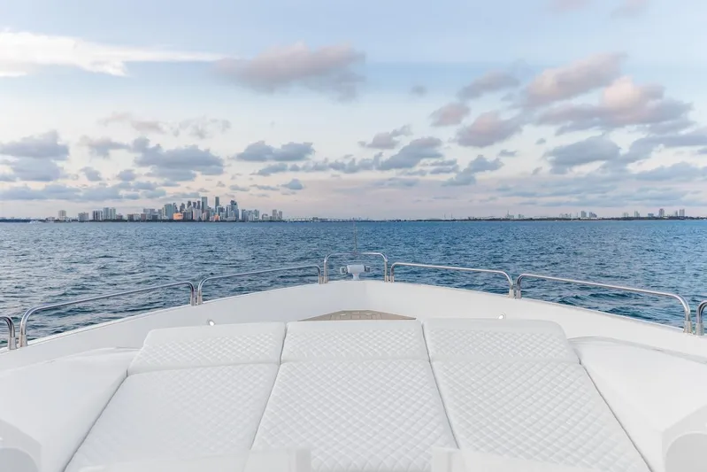 Skyfall Yacht Photos Pics Bow view from 2008 Sunseeker Predator 108 yacht, overlooking ocean and distant city skyline.