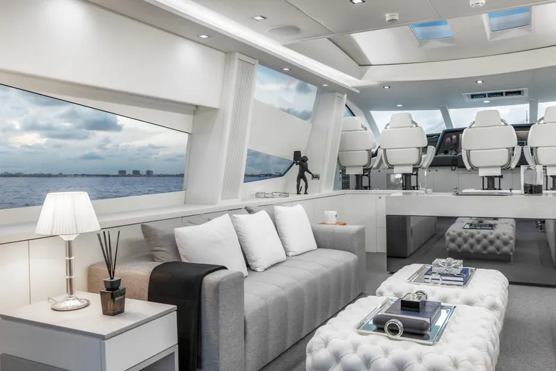 Skyfall Yacht Photos Pics Luxurious interior of 2008 Sunseeker Predator 108 yacht with modern seating and ocean view.