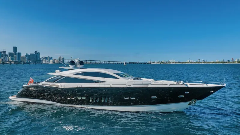 Skyfall Yacht Photos Pics 2008 Sunseeker Predator 108 yacht cruising on blue waters near a city skyline.