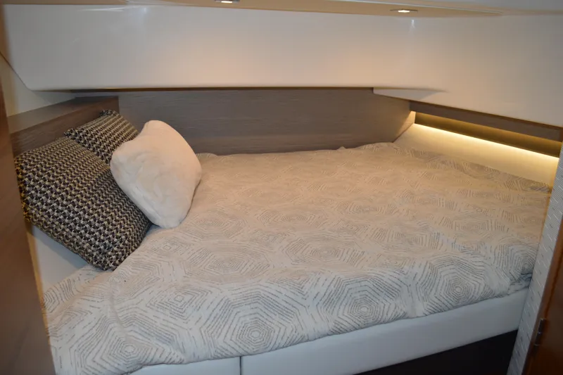 Hopena Yacht Photos Pics Cozy cabin interior of 2024 Tiara Yachts 34 LS with stylish bedding and pillows.
