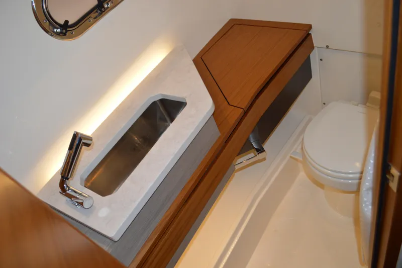 Hopena Yacht Photos Pics 2024 Tiara Yachts 34 LS bathroom with modern sink and toilet.