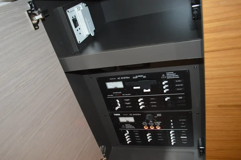 Hopena Yacht Photos Pics Electrical panel inside 2024 Tiara Yachts 34 LS, showcasing AC and DC systems.