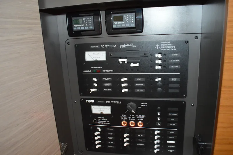 Hopena Yacht Photos Pics Electrical control panel on 2024 Tiara Yachts 34 LS, featuring AC and DC systems.