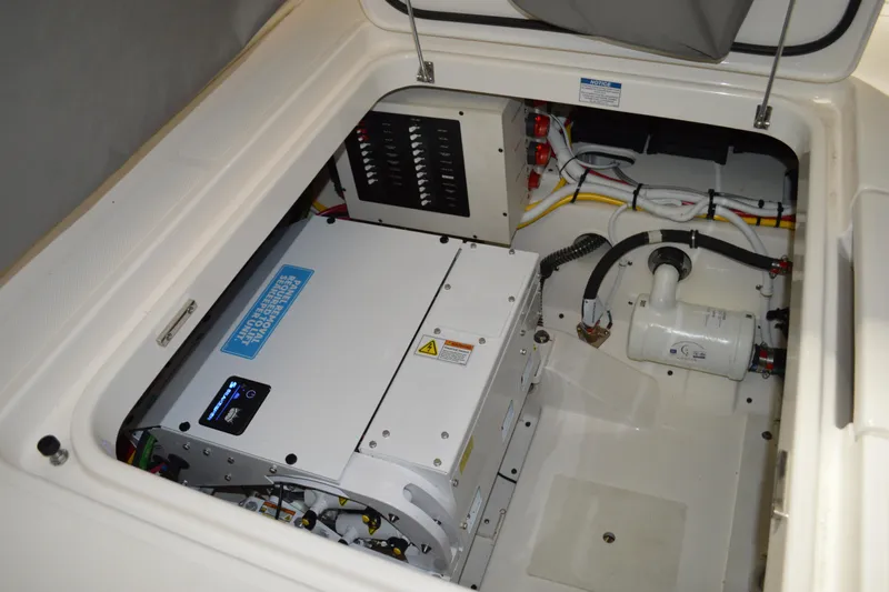 Hopena Yacht Photos Pics 2024 Tiara Yachts 34 LS engine compartment with electrical components and wiring.
