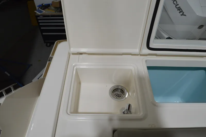 Hopena Yacht Photos Pics 2024 Tiara Yachts 34 LS sink and storage compartment detail.