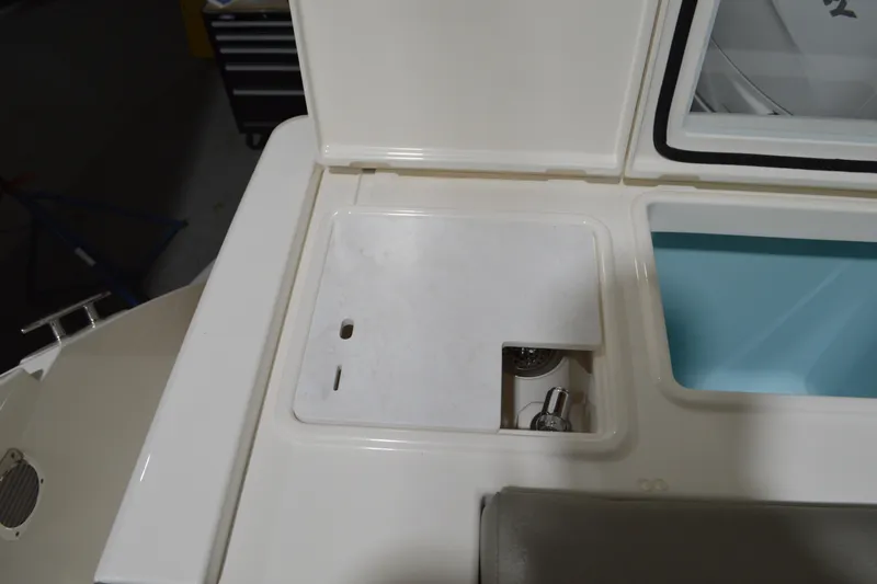 Hopena Yacht Photos Pics 2024 Tiara Yachts 34 LS boat interior detail with storage compartment and sink.