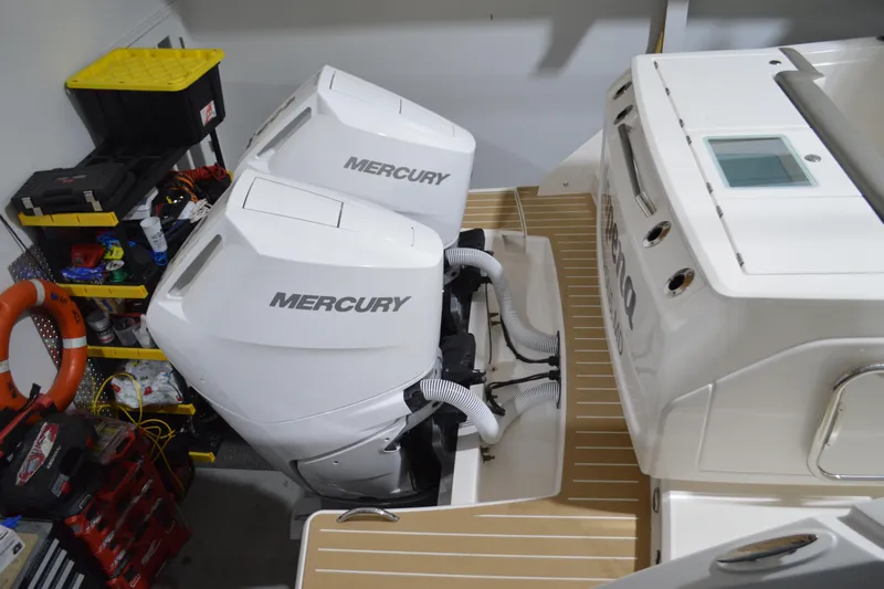 Hopena Yacht Photos Pics 2024 Tiara Yachts 34 LS with dual Mercury outboard engines in a garage setting.