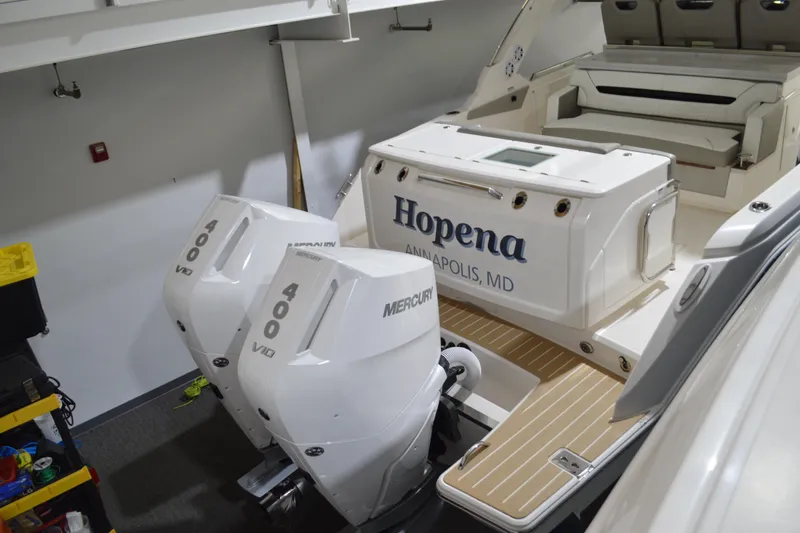 Hopena Yacht Photos Pics 2024 Tiara Yachts 34 LS with dual Mercury 400 engines, docked indoors.