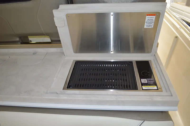 Hopena Yacht Photos Pics 2024 Tiara Yachts 34 LS grill station with stainless steel cover and integrated controls.