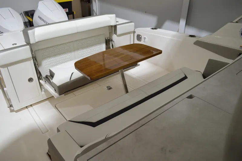 Hopena Yacht Photos Pics 2024 Tiara Yachts 34 LS interior with seating and wooden table.