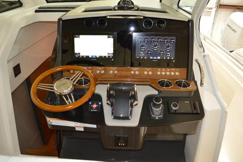 Hopena Yacht Photos Pics 2024 Tiara Yachts 34 LS helm with modern controls and navigation displays.