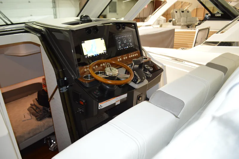 Hopena Yacht Photos Pics 2024 Tiara Yachts 34 LS helm with modern controls and wooden steering wheel.