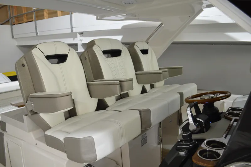 Hopena Yacht Photos Pics 2024 Tiara Yachts 34 LS interior with luxurious seating and modern helm design.