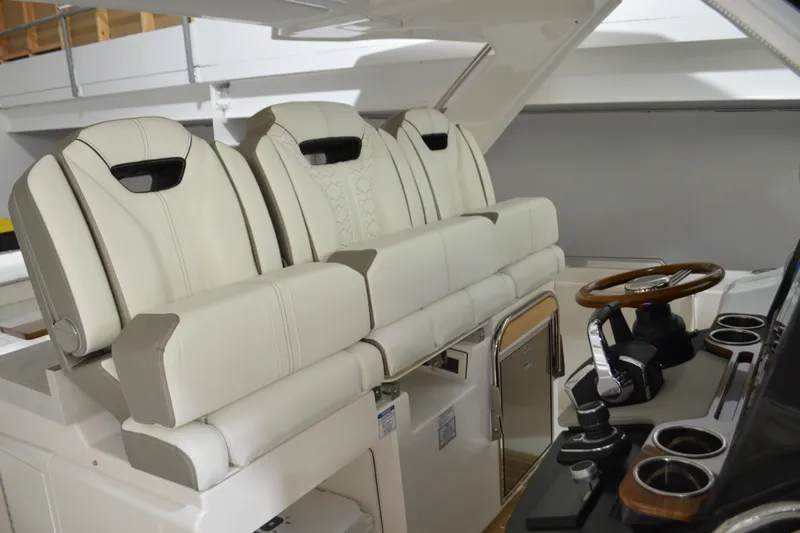 Hopena Yacht Photos Pics 2024 Tiara Yachts 34 LS interior with luxurious seating and modern helm controls.