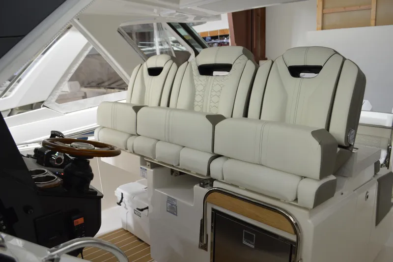 Hopena Yacht Photos Pics 2024 Tiara Yachts 34 LS interior with luxurious seating and modern helm design.