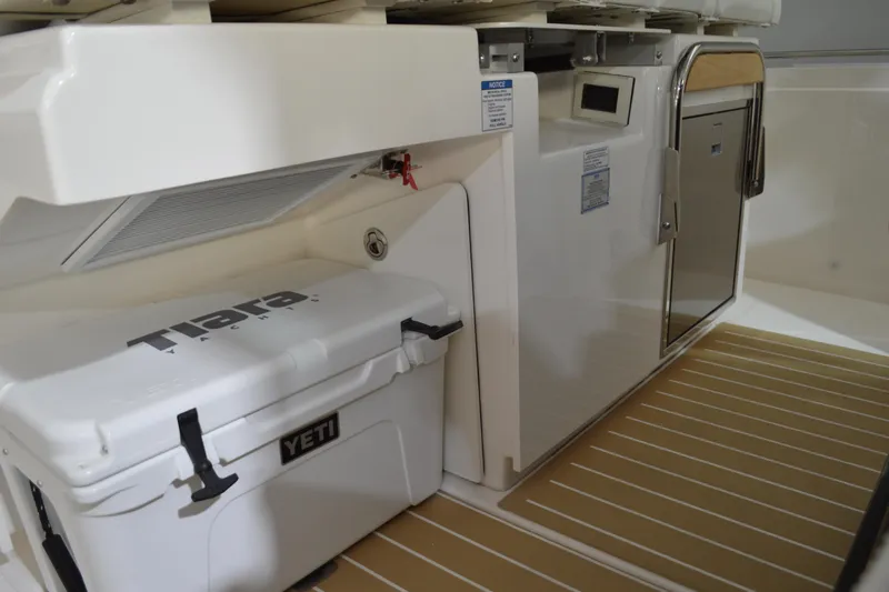 Hopena Yacht Photos Pics 2024 Tiara Yachts 34 LS interior with YETI cooler and storage compartment.