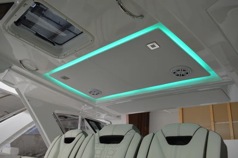 Hopena Yacht Photos Pics 2024 Tiara Yachts 34 LS interior with modern lighting and luxurious seating.