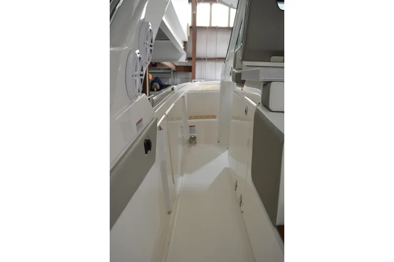 Hopena Yacht Photos Pics 2024 Tiara Yachts 34 LS interior walkway with modern design and seating.
