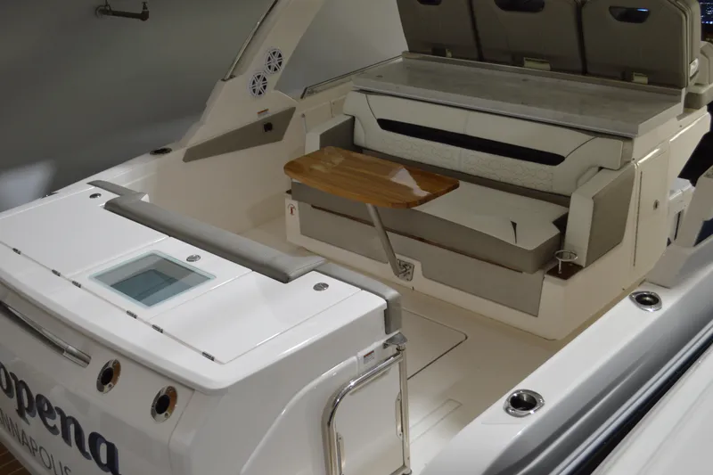 Hopena Yacht Photos Pics 2024 Tiara Yachts 34 LS interior with seating and wooden table.