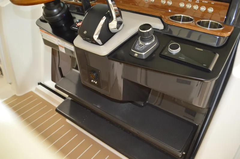 Hopena Yacht Photos Pics 2024 Tiara Yachts 34 LS helm with modern controls and sleek design.