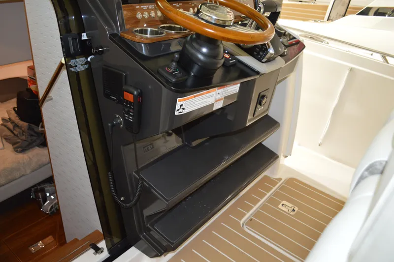 Hopena Yacht Photos Pics 2024 Tiara Yachts 34 LS helm with wooden steering wheel and control panel.
