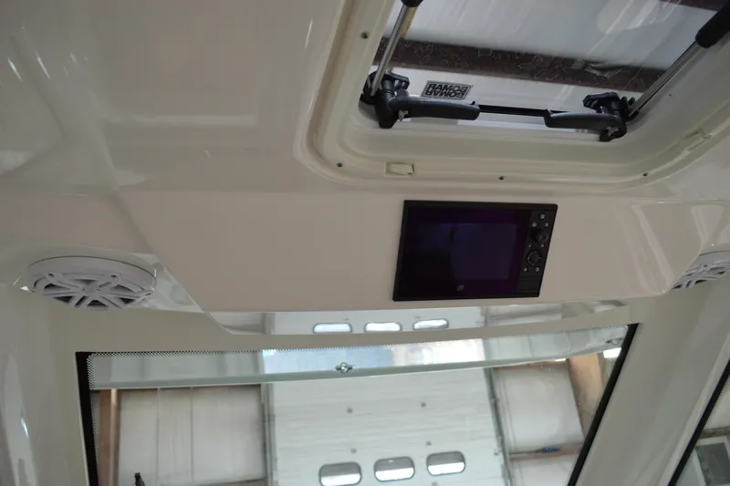 Hopena Yacht Photos Pics 2024 Tiara Yachts 34 LS interior ceiling with speakers and control panel.