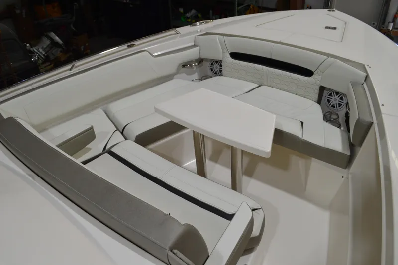 Hopena Yacht Photos Pics 2024 Tiara Yachts 34 LS interior with white seating and table.