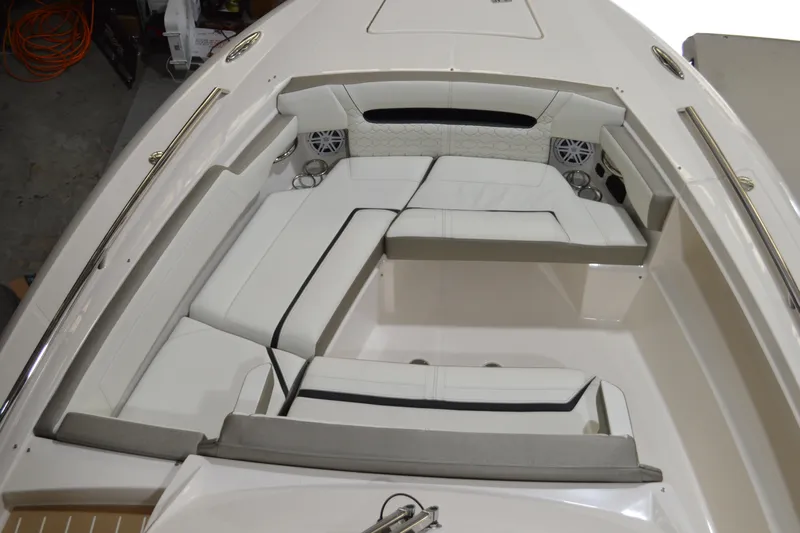 Hopena Yacht Photos Pics 2024 Tiara Yachts 34 LS boat interior with white cushioned seating and cup holders.
