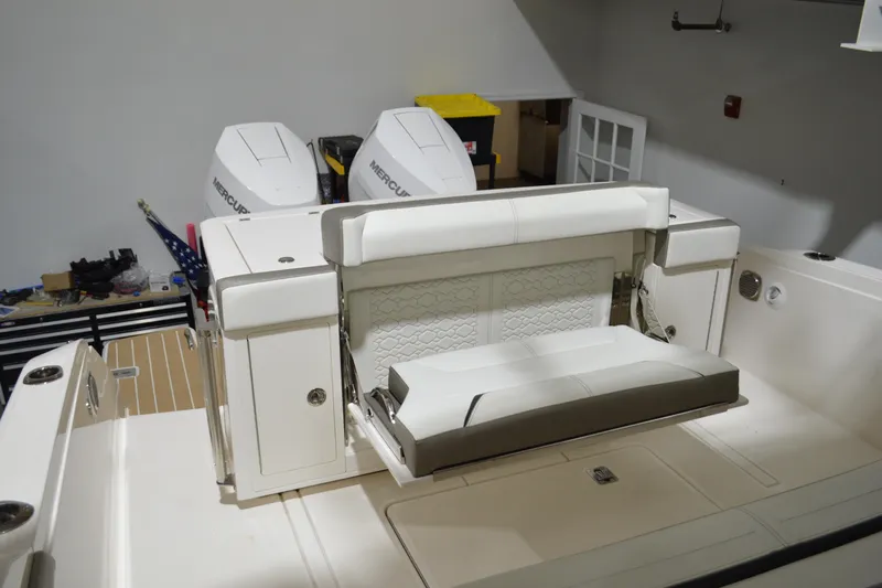 Hopena Yacht Photos Pics 2024 Tiara Yachts 34 LS boat interior with foldable seating and dual Mercury outboard engines.