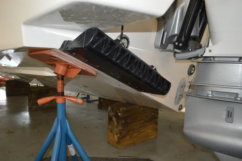 Hopena Yacht Photos Pics 2024 Tiara Yachts 34 LS boat on stand, showing hull and motor details.