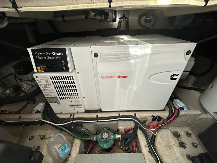 Mother Ship Yacht Photos Pics Cummins Onan marine generator in 2011 Meridian 441 Sedan Bridge engine room.