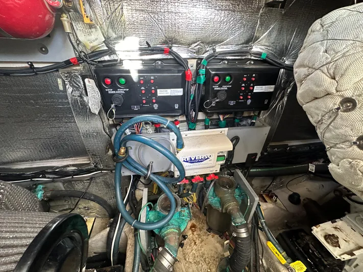 Mother Ship Yacht Photos Pics Engine room of 2011 Meridian 441 Sedan Bridge, showcasing control panels and wiring.