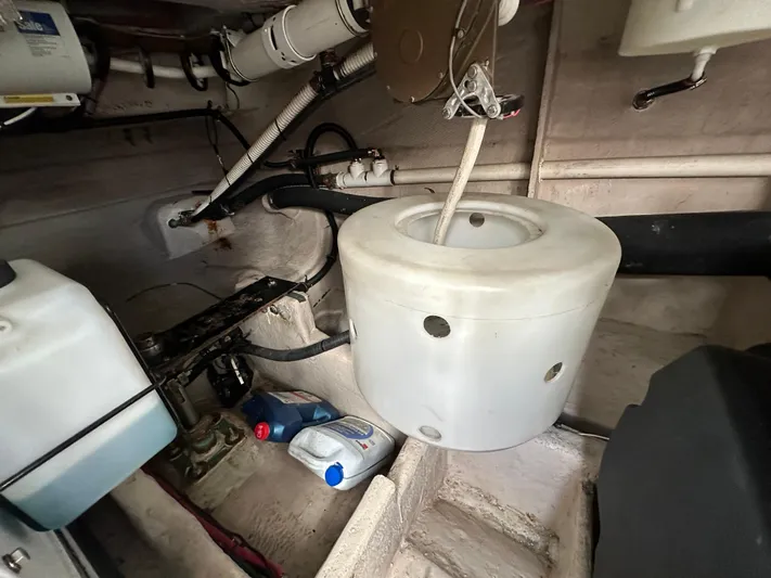 Mother Ship Yacht Photos Pics Engine room of 2011 Meridian 441 Sedan Bridge, showing components and maintenance supplies.