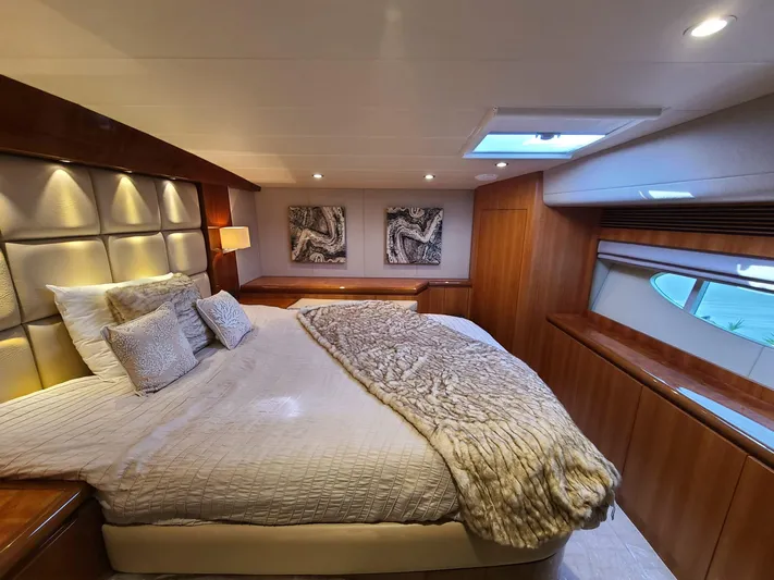  Yacht Photos Pics Luxurious bedroom interior on a 2017 Horizon PC60 yacht with elegant bedding and modern decor.