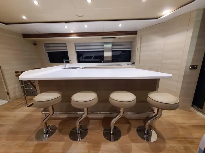  Yacht Photos Pics Luxurious yacht interior with modern bar stools and sleek design, Horizon PC60, 2017 model.