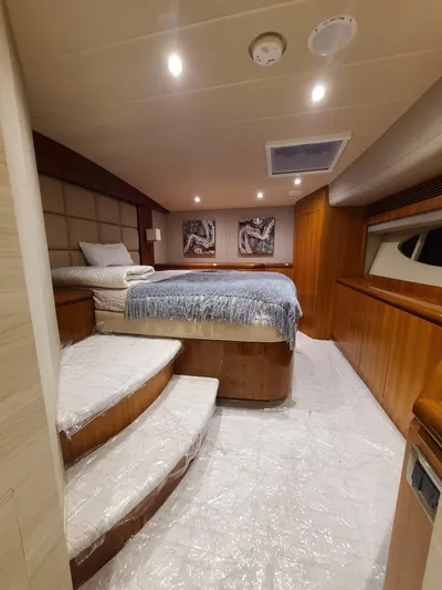  Yacht Photos Pics Luxurious cabin interior of a 2017 Horizon PC60 yacht with elegant wood paneling.