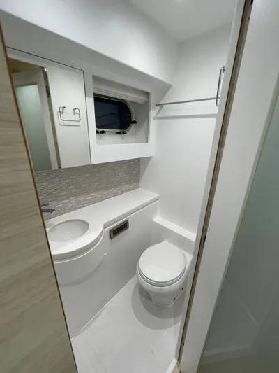  Yacht Photos Pics Compact modern bathroom in 2017 Horizon PC60 yacht, featuring sleek fixtures and minimalist design.