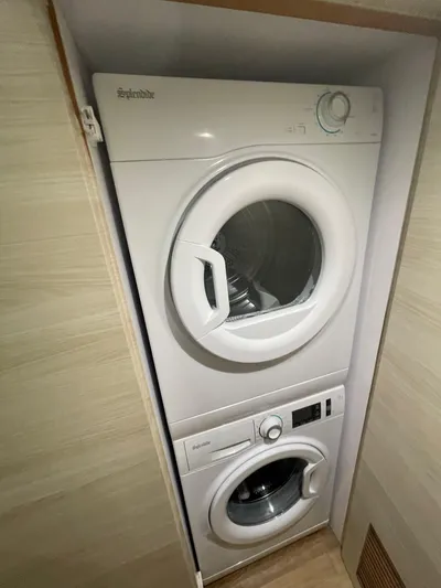  Yacht Photos Pics Stacked washer and dryer in a compact laundry space, Horizon PC60, 2017 model.