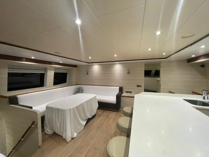  Yacht Photos Pics Luxurious interior of 2017 Horizon PC60 yacht with modern seating and elegant lighting.