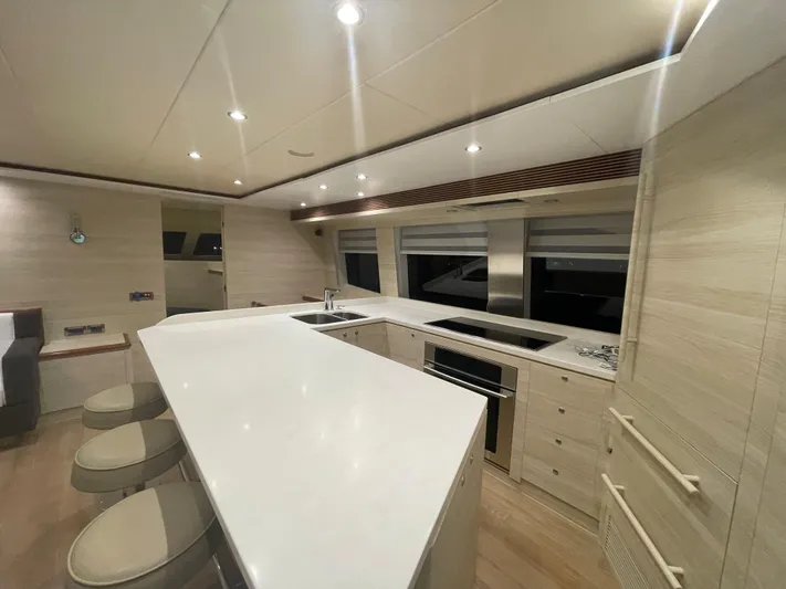 Yacht Photos Pics Luxurious kitchen interior of 2017 Horizon PC60 yacht with modern appliances and sleek design.