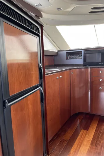Mother Ship Yacht Photos Pics Luxurious 2011 Meridian 441 Sedan Bridge yacht interior with sleek wood cabinetry.