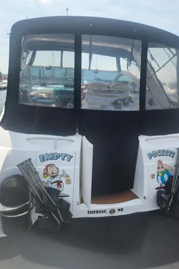 Empty Pockets Yacht Photos Pics 2006 Doral Boca Grande boat with "Empty Pockets" graphics on the stern.