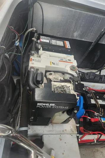Empty Pockets Yacht Photos Pics Engine compartment of a 2006 Doral Boca Grande boat with Kohler power system.