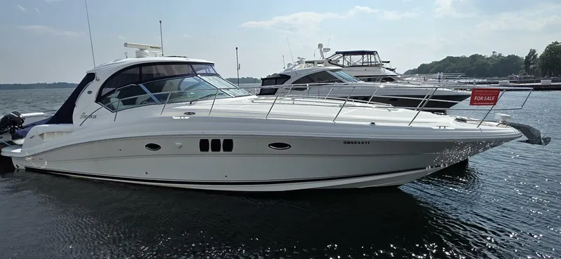  Yacht Photos Pics 2008 Sea Ray 44 Sundancer yacht docked, with "For Sale" sign, on a sunny day.