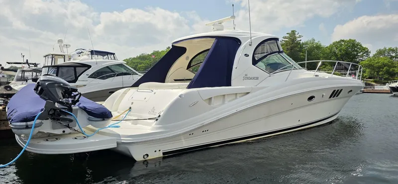  Yacht Photos Pics 2008 Sea Ray 44 Sundancer yacht docked in a marina under a partly cloudy sky.