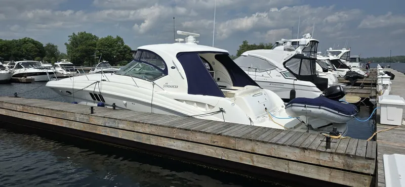  Yacht Photos Pics 2008 Sea Ray 44 Sundancer yacht docked at marina under cloudy sky.