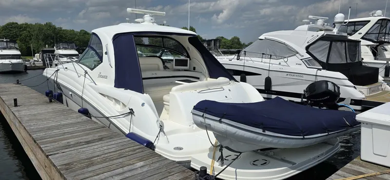  Yacht Photos Pics 2008 Sea Ray 44 Sundancer yacht docked at marina, featuring sleek design and blue covers.