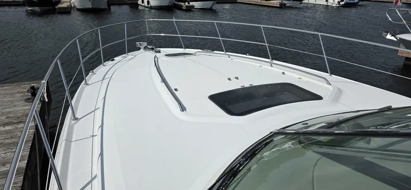  Yacht Photos Pics 2008 Sea Ray 44 Sundancer yacht docked at marina, showcasing sleek deck design.